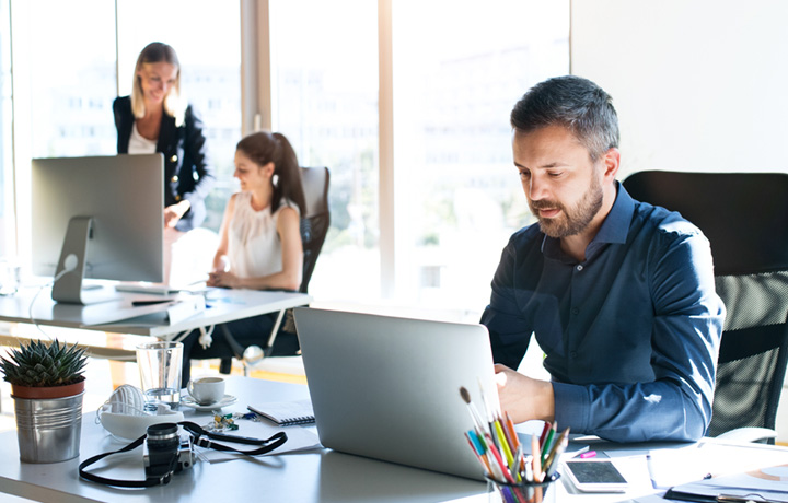 Man on computer in office