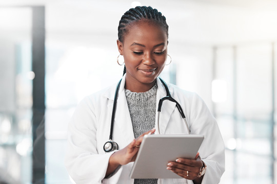 health care provider holding a tablet